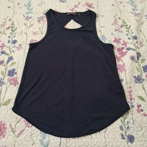 Athleta women’s sleeveless tank top in dark blue (navy). Designed with a flatter